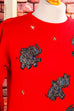 roter Pulli mit Glitzer-Elefanten
