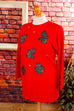 roter Pulli mit Glitzer-Elefanten