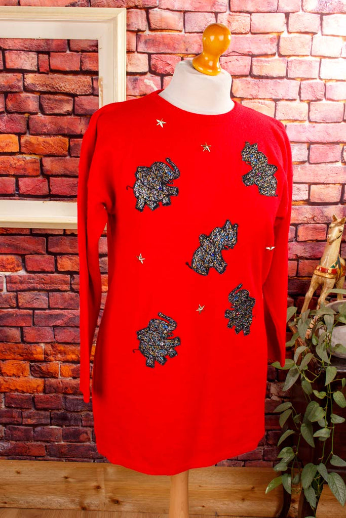 roter Pulli mit Glitzer-Elefanten