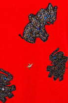 roter Pulli mit Glitzer-Elefanten