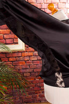 elegantes Fledermaustop schwarz Satin