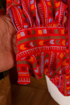 asymmetrische Seidenbluse rot bunt