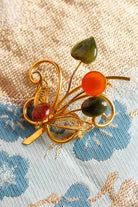 goldene Brosche floral + Schmucksteine