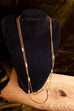 goldene Kette mit Perlen