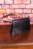 70s Ledertasche schwarz schlicht