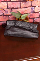 kleine Handgelenktasche schwarz Leder