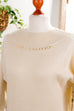 Pulloverkleid creme Perlen